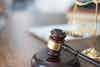 a gavel on a wooden stand