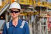 a woman wearing a hard hat and sunglasses