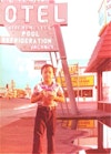 a young boy standing in front of a sign